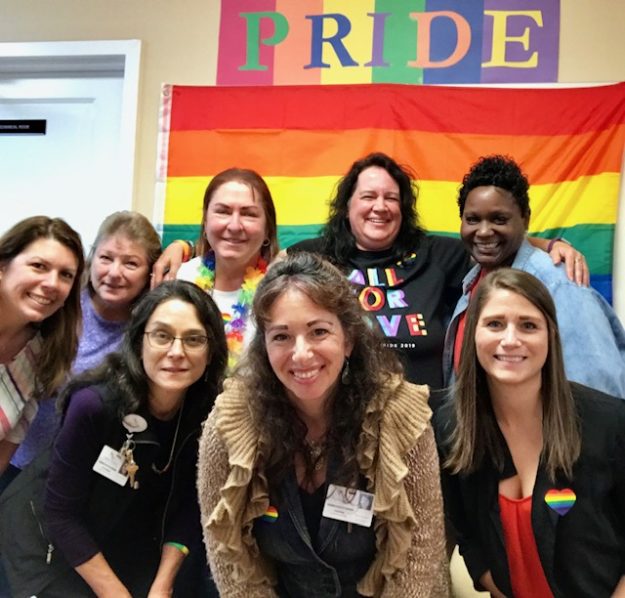 a group of people at new vitae celebrate pride month