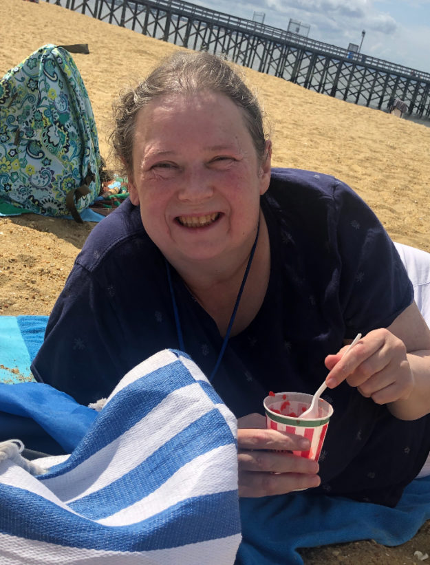 a woman at new vitae wellness and recovery says goodbye to summer