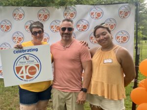 Employees with 40th Anniversary Sign 