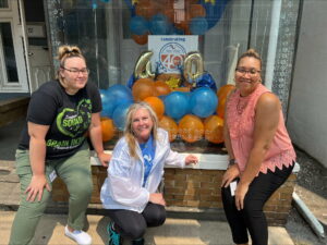 Employees with 40th Anniversary Sign 